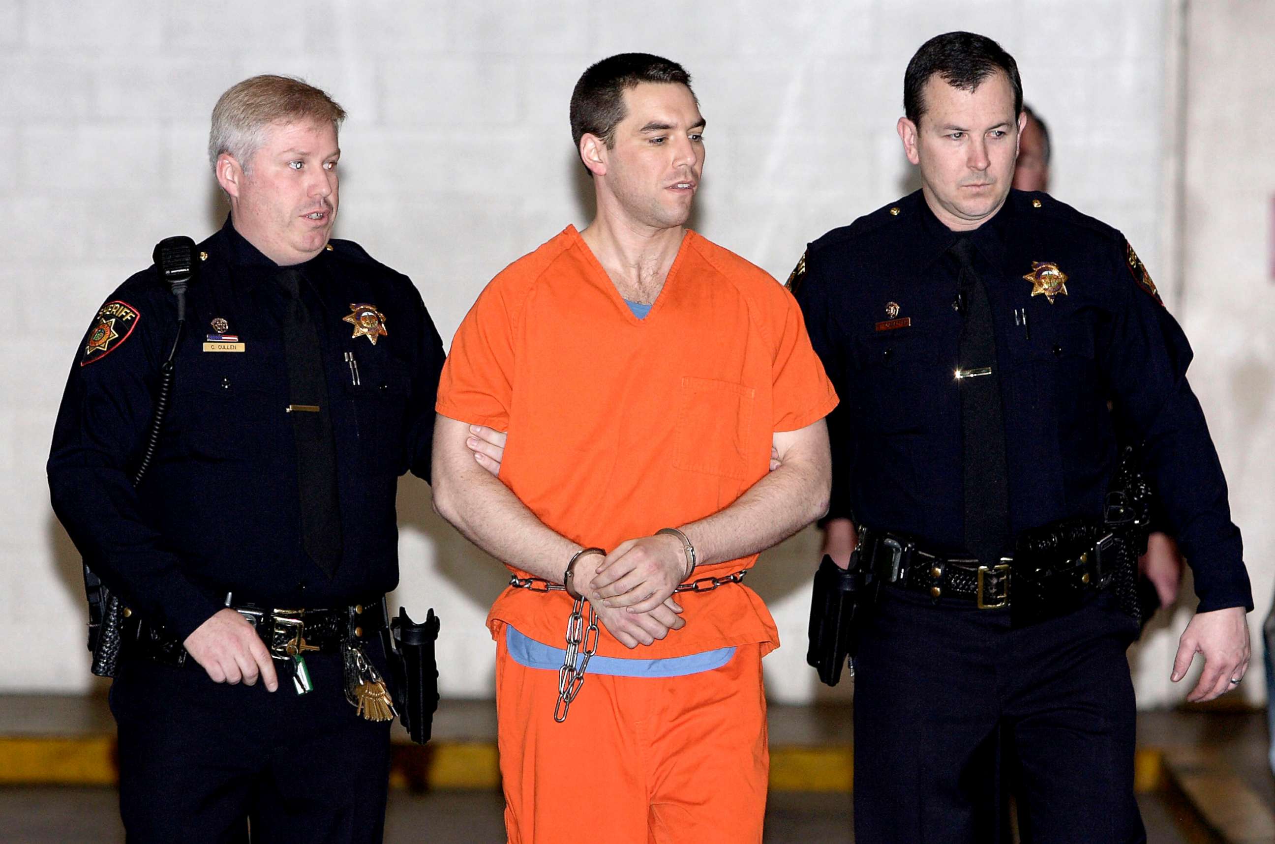 PHOTO: Scott Peterson is escorted by two San Mateo County Sheriff deputies as he is walked from the jail to a waiting van in Redwood City, Calif., March 17, 2005.