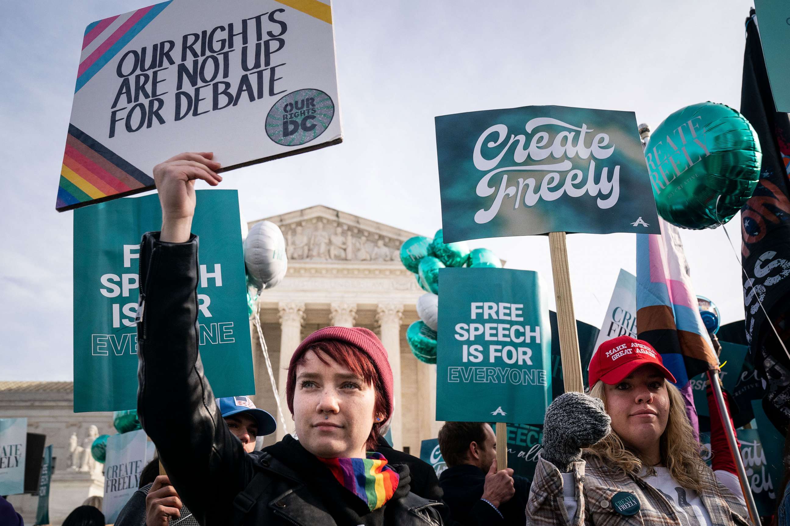 PHOTO: Members of both sides of the lgbtq Colorado debate stand in front of the Supreme Court of the United States on Monday, Dec. 5, 2022 in Washington, DC.