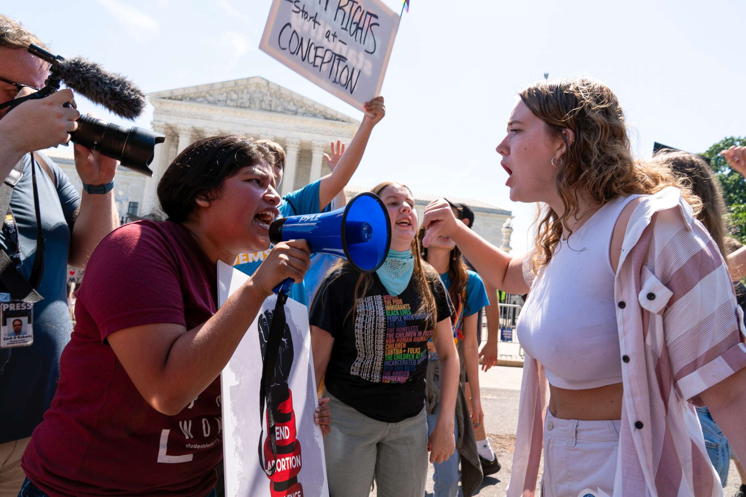 PHOTO: An anti-abortion demonstrator, left, argues with an abortion-rights activist outside the Supreme Court in Washington, June 25, 2022.