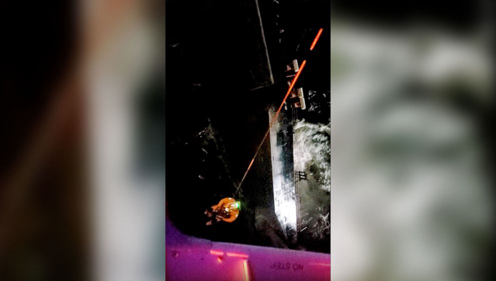 PHOTO: A private helicopter crew attempts a rescue at the sight of the capsizing of the Seacor Power ship in the Gulf of Mexico off the coast of Louisiana in an image from video on the night of April 13, 2021.