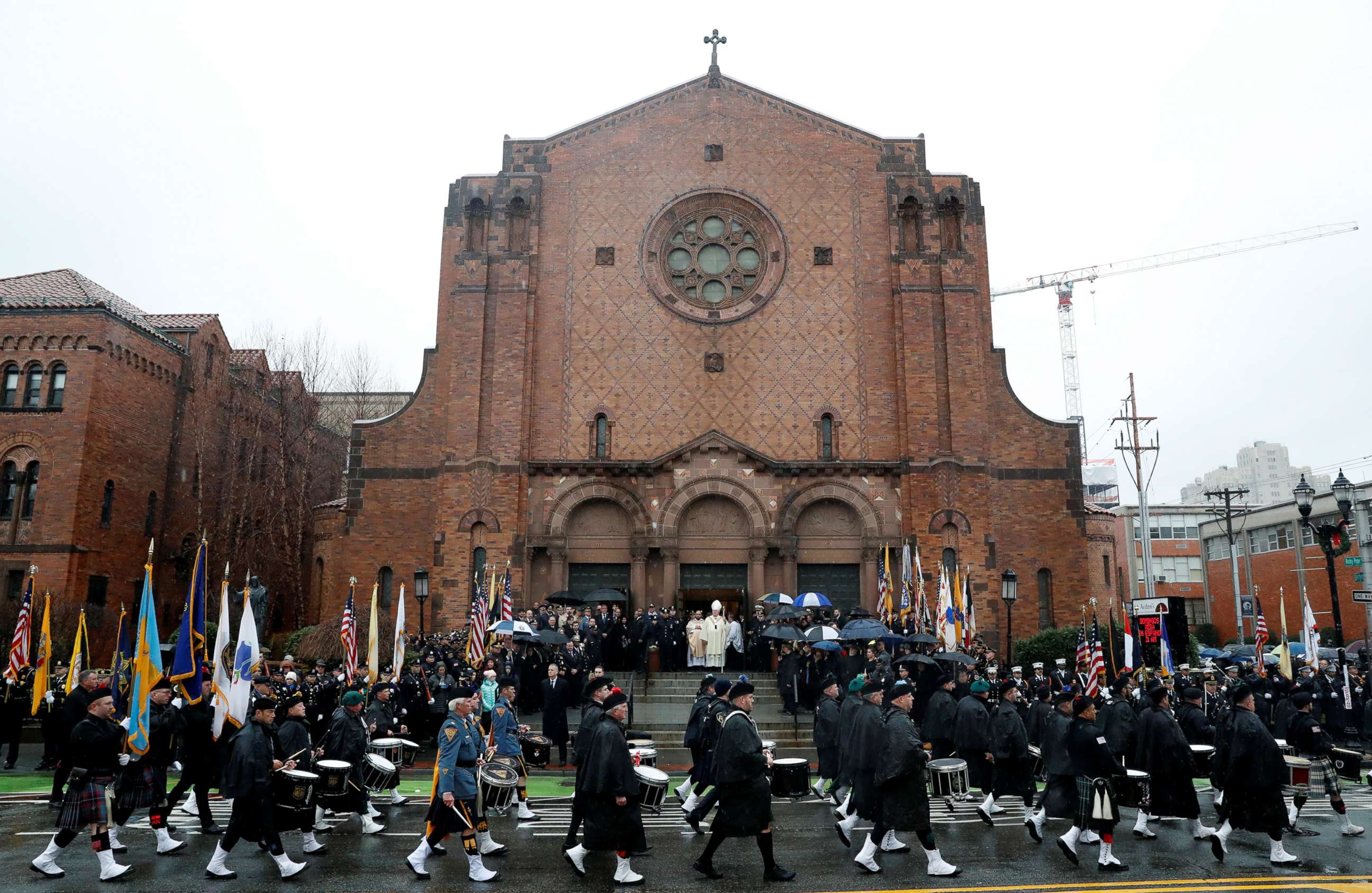 PHOTO: A police procession arrives at the funeral service for Jersey City Police Detective Joseph Seals at St. Aedan's Church in Jersey City, N.J., Dec. 17, 2019.