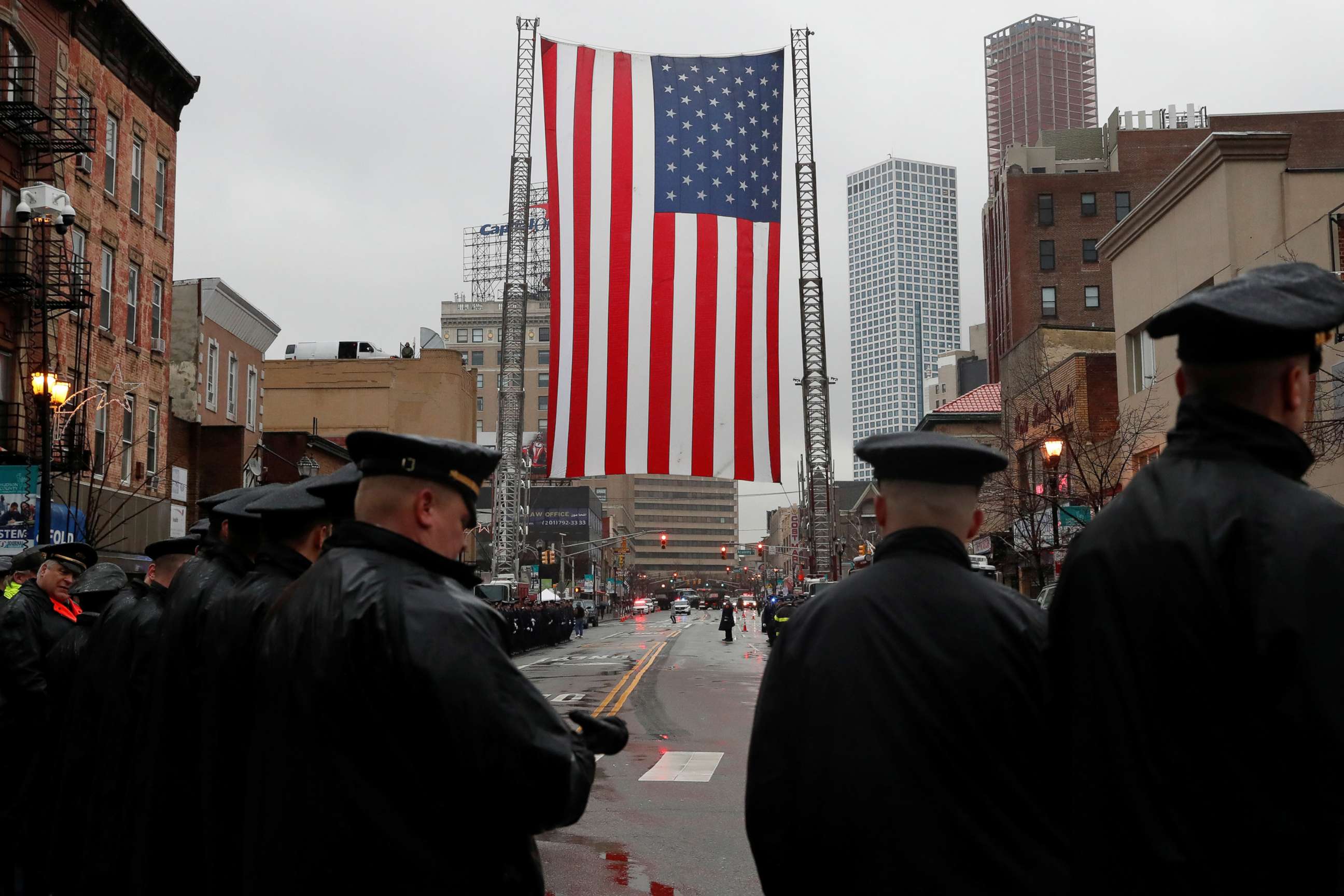 PHOTO: Police officers gather on the street ahead of the funeral service for Jersey City Police Detective Joseph Seals at St. Aedan's Church in Jersey City, N.J., Dec. 17, 2019. 