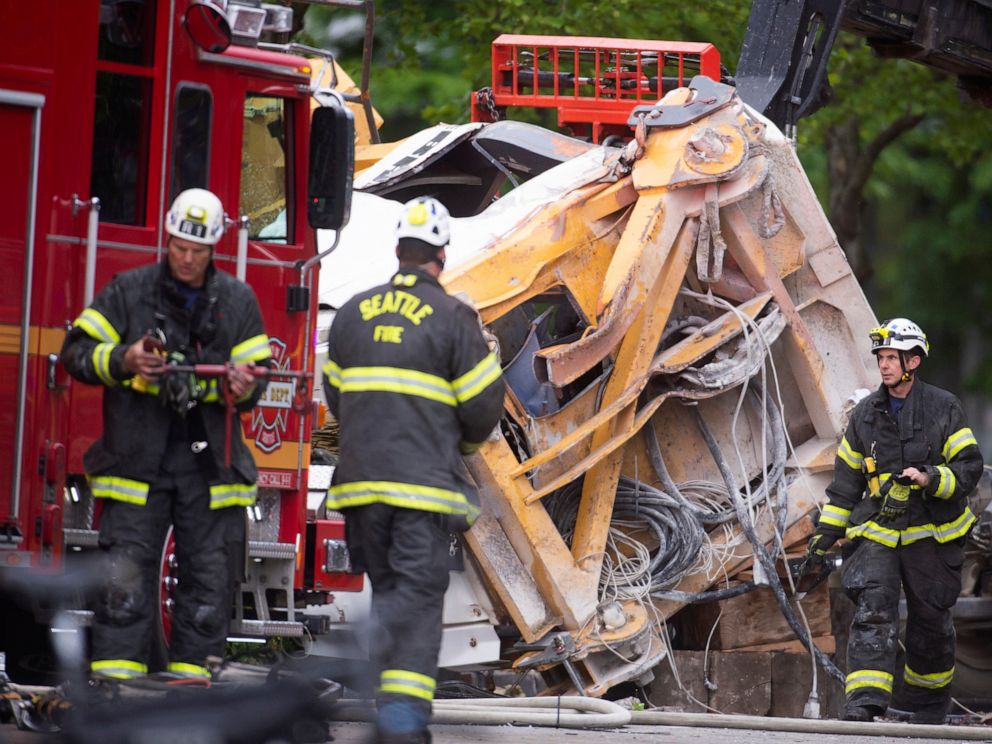PHOTO: Emergency crews work the scene of a construction crane collapse near the intersection of Mercer Street and Fairview Avenue near Interstate 5 in Seattle, on Saturday, April 27, 2019.