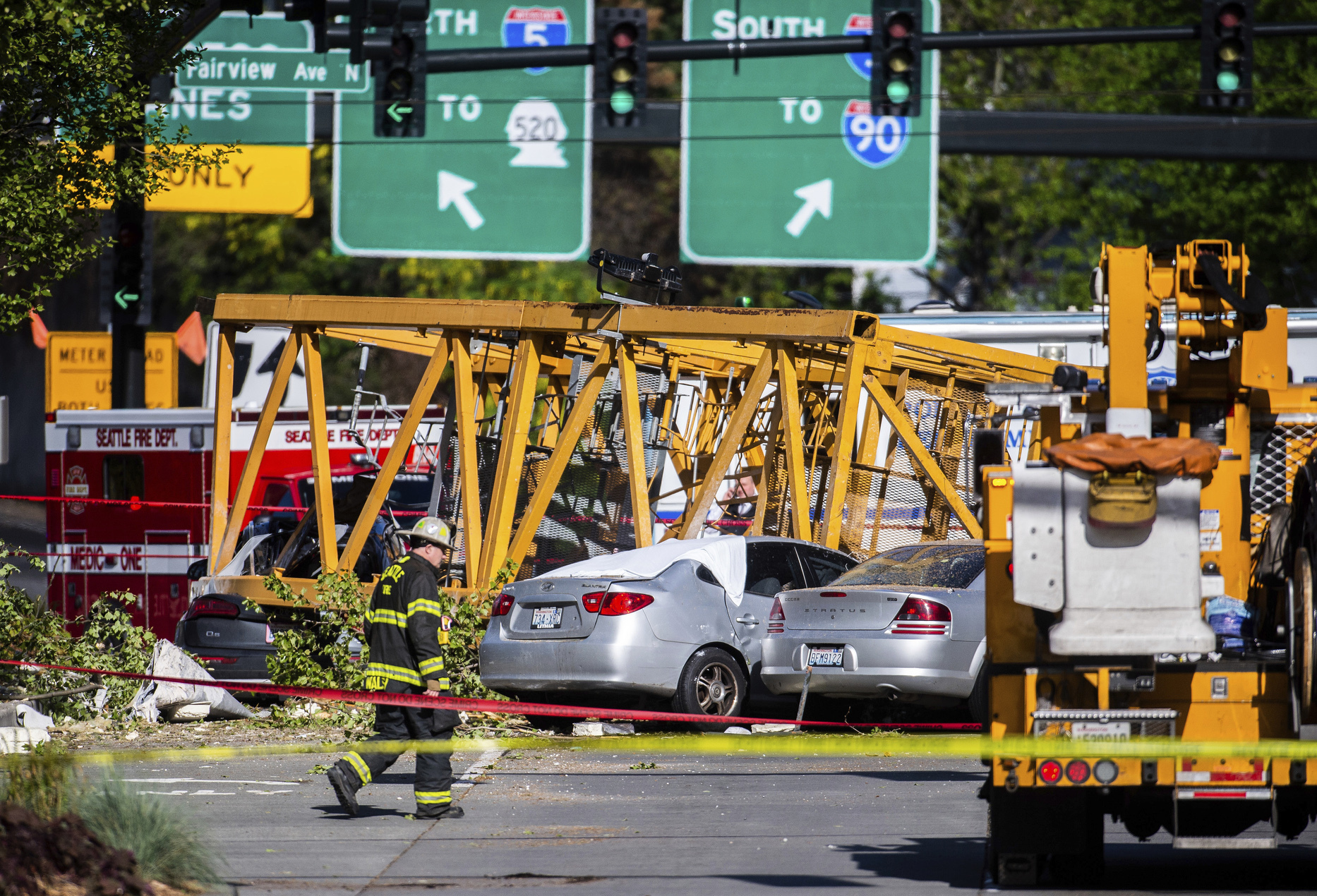 PHOTO: Emergency crews work the scene of a construction crane collapse near Interstate 5 in Seattle, on Saturday, April 27, 2019. The crane was atop an office building under construction in a densely populated area.