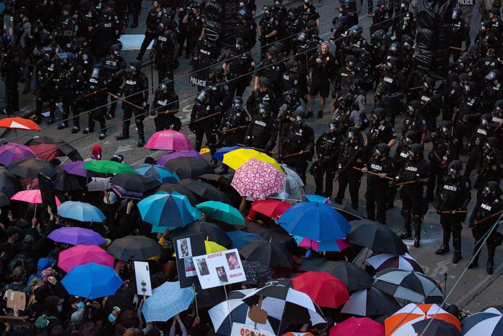 PHOTO: Demonstrators face off with law enforcement personnel on June 6, 2020, in Seattle.