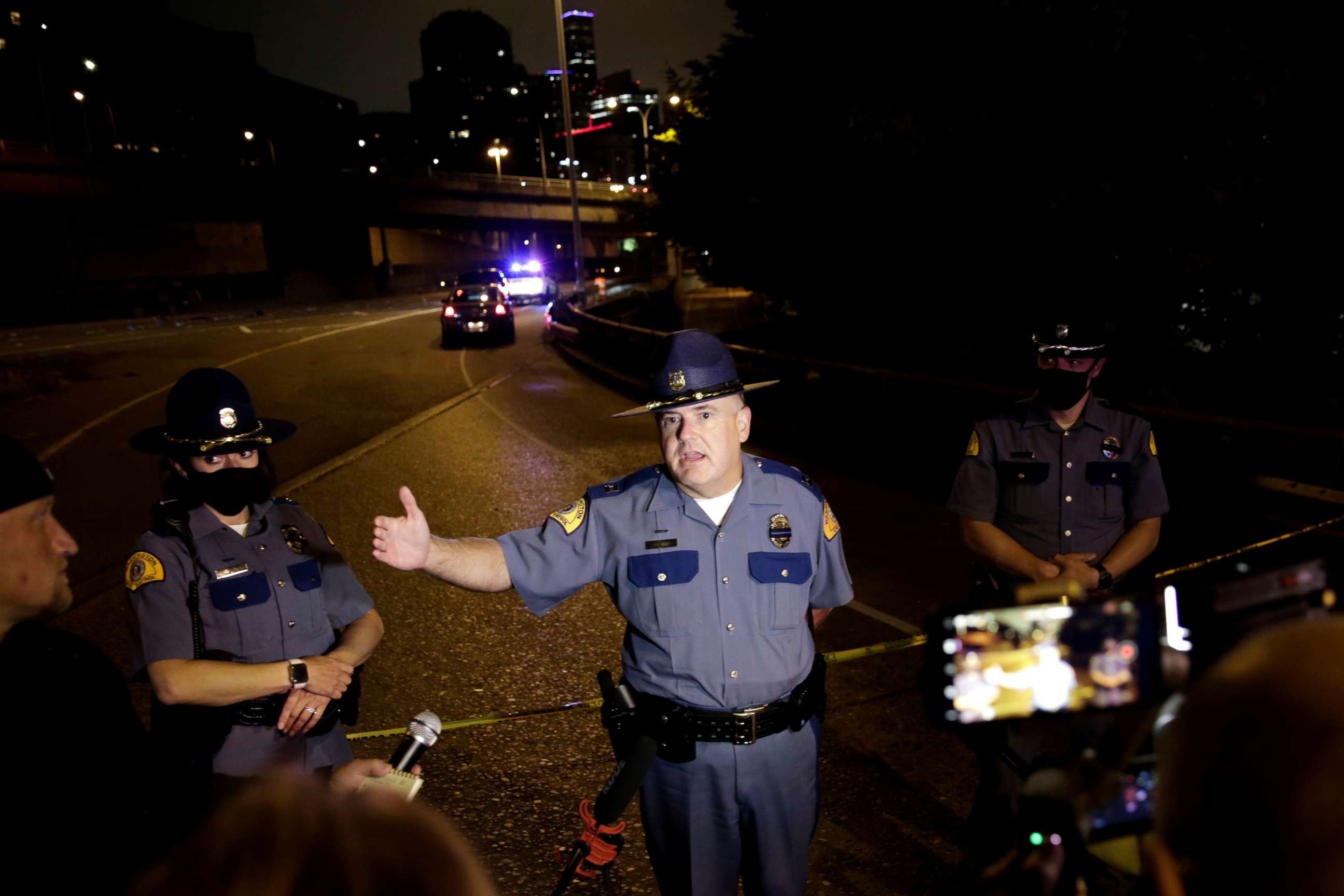 PHOTO: Washington State Patrol Capt. Ron Mead briefs media near the scene where two people in a group of protesters were struck by a car on Interstate 5 while the highway was closed to traffic due to the protest in Seattle, July 4, 2020.