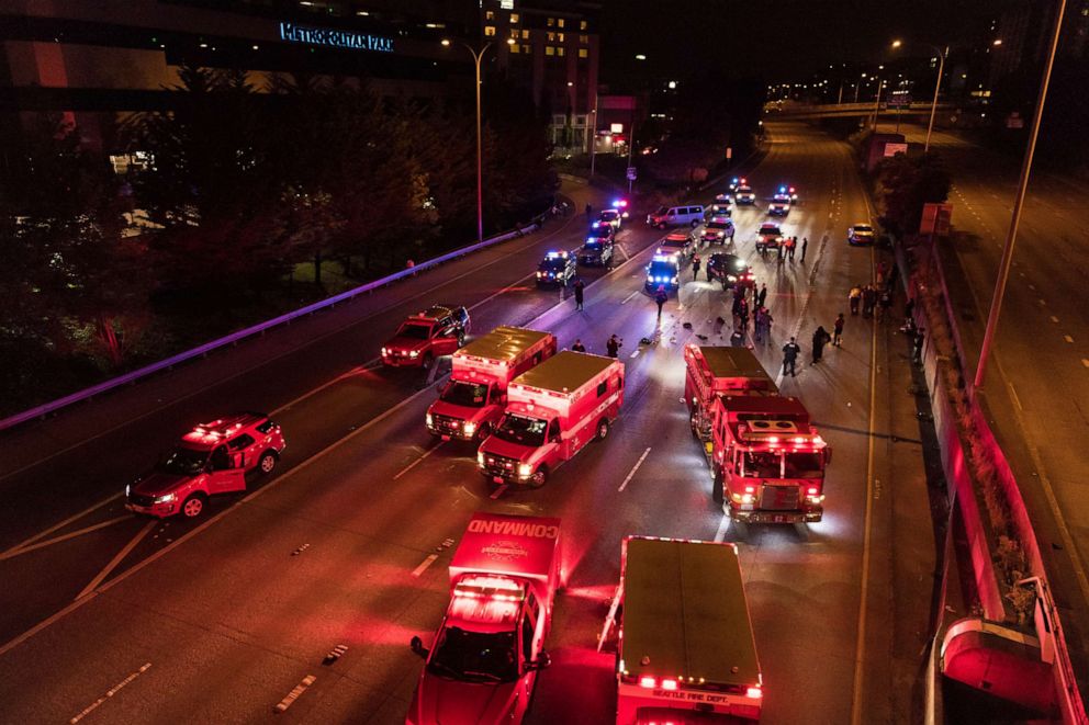 PHOTO: Emergency personnel work at the site where a driver sped through a protest-related closure on the Interstate 5 freeway in Seattle, July 4, 2020. 