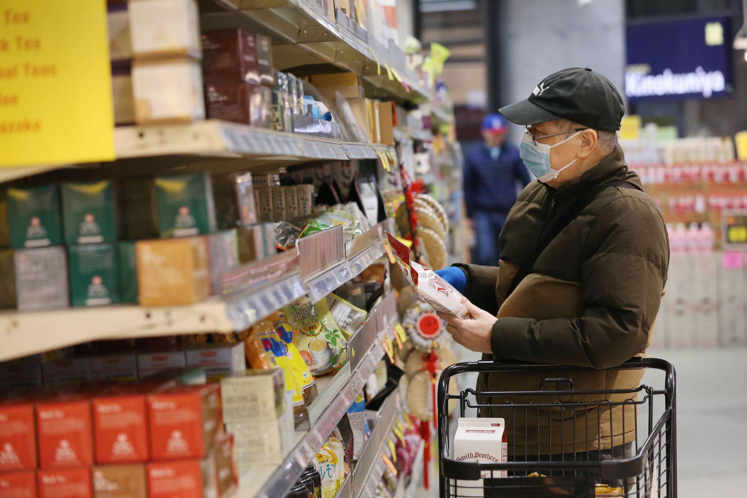PHOTO: A man shops for groceries during special hours open to seniors only at a supermarket in Seattle,  March 18, 2020.