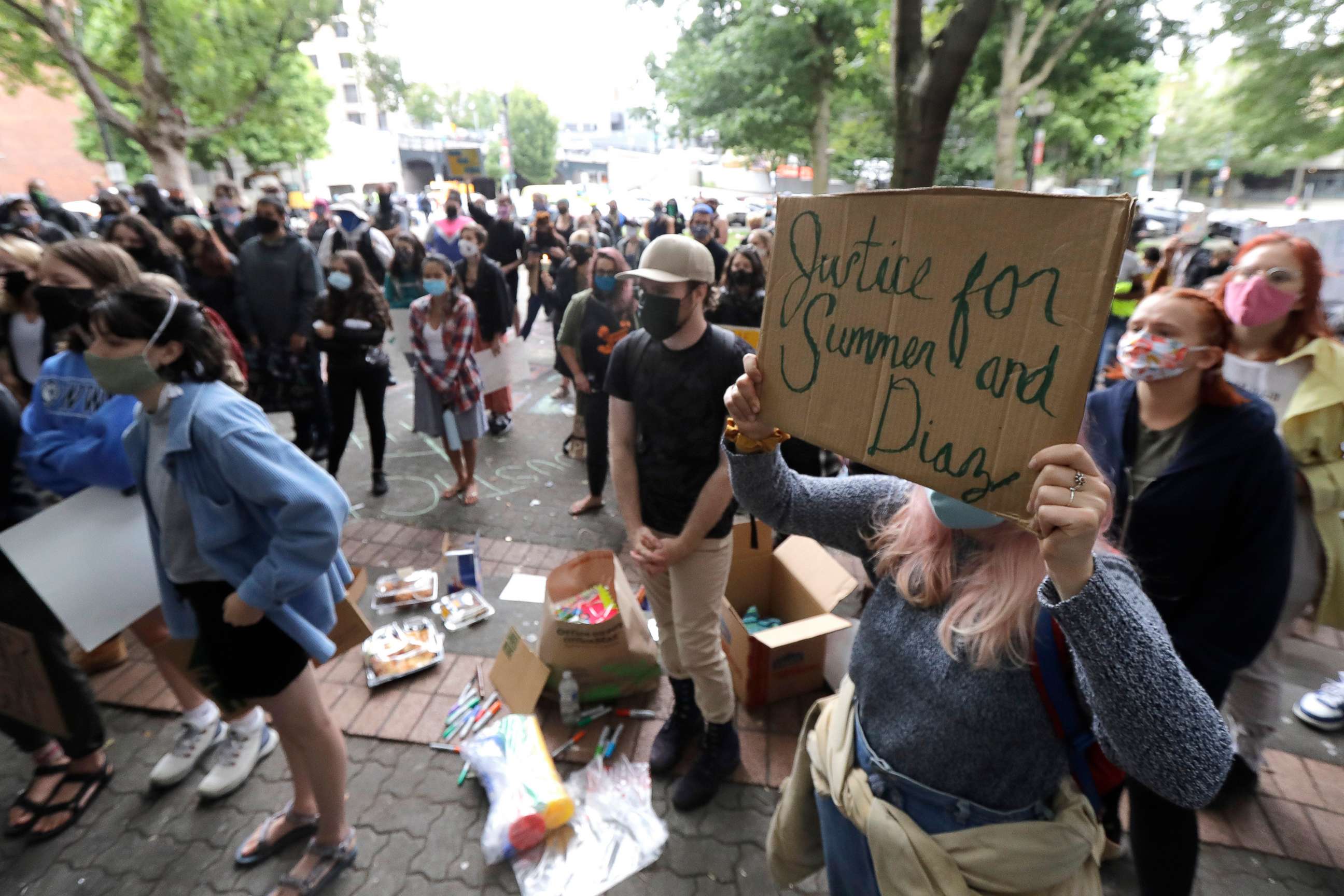 PHOTO: A person holds a sign that reads "Justice for Summer and Diaz," during a rally near the King County Courthouse, July 22, 2020, in Seattle, to call for justice in the death of Summer Taylor, who was killed by a car during a protest.