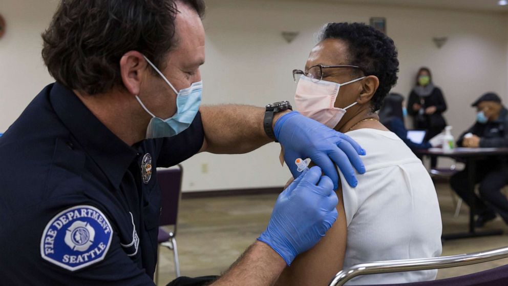 PHOTO: A member of the Seattle Fire Department administers a dose of the Moderna COVID-19 vaccine to a patient in Seattle, Feb. 5, 2021.