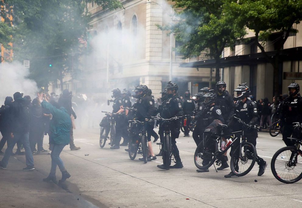 PHOTO: Seattle police use a bike line after using pepper spray and flash bangs during a protest in Seattle, May 31, 2020.