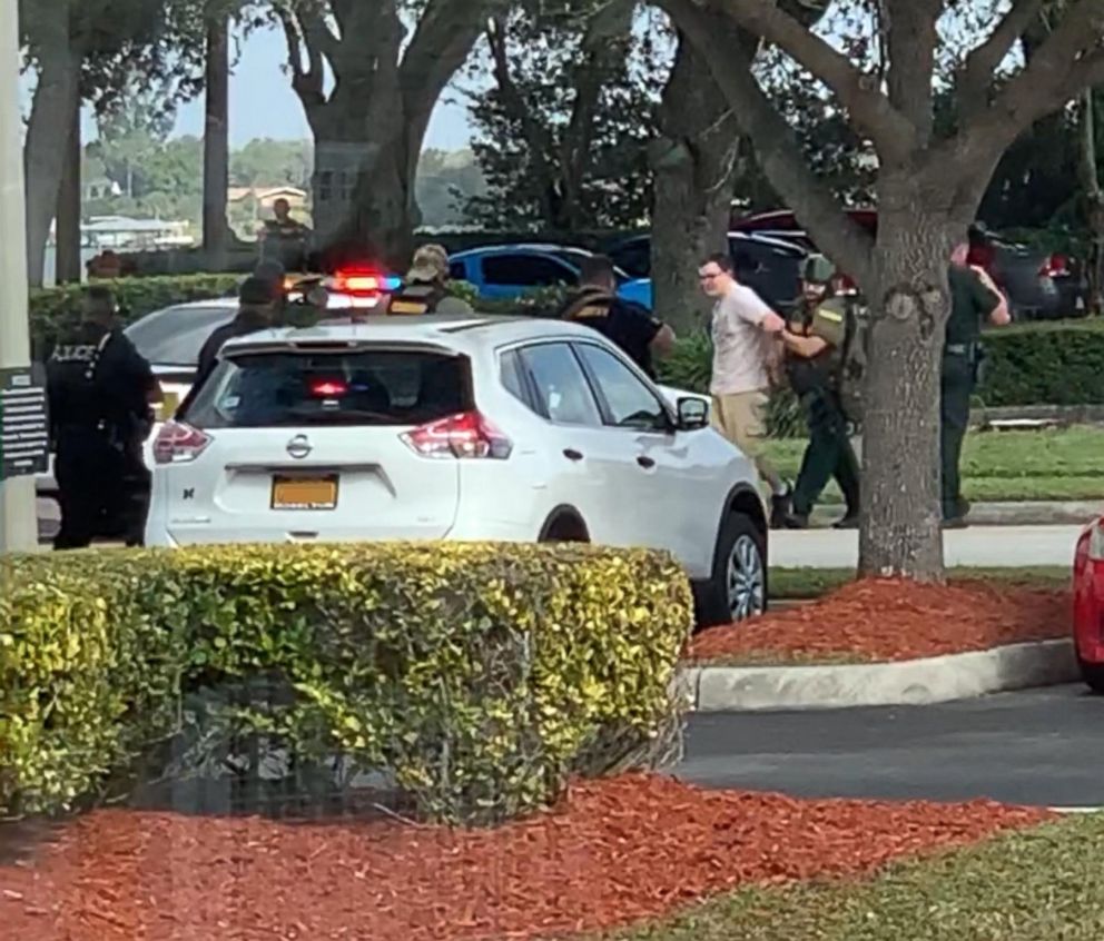 PHOTO: Video shared on social media shows a man being led out of a SunTrust branch in Sebring, Fla., after a shooting on Jan. 23, 2019.