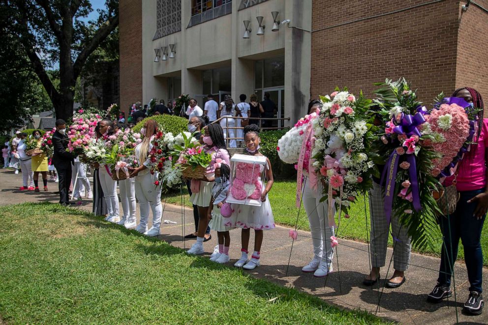 PHOTO: Family and friends of Secoriea Turner present floral arrangements during her home-going service at New Calvary Missionary Church in the Sylvan Hills community in Atlanta, July 15, 2020.