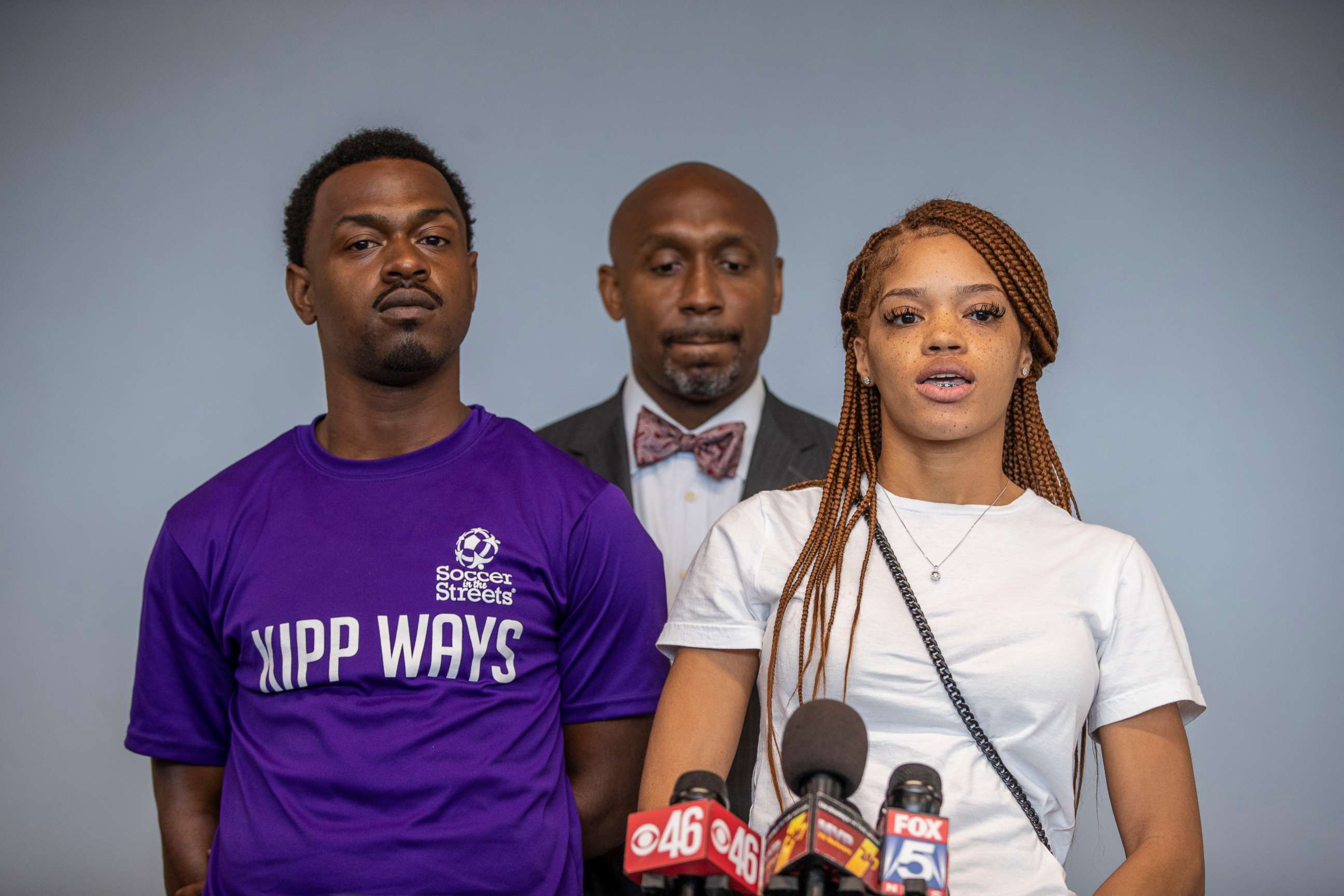 PHOTO: Attorney Mawuli Davis, center, stands with his clients, parents of Secoriea Turner, as they speak during a press conference to announce a lawsuit against the city of Atlanta, June 7, 2021.