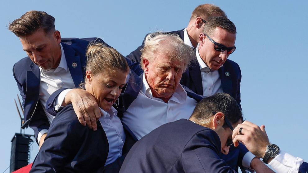 PHOTO: Republican presidential candidate former President Donald Trump is rushed offstage by U.S. Secret Service agents after being grazed by a bullet during a rally on July 13, 2024 in Butler, Pennsylvania.