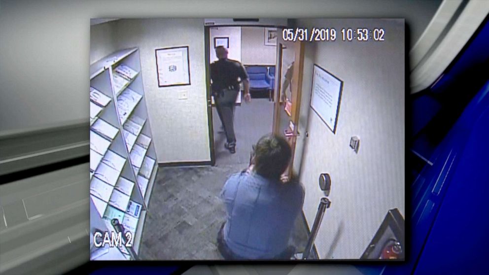 PHOTO: Security video shows security guard Seth Eklund pulling a gun on Lucas County, Ohio, Sheriff's Deputy Alan Gaston at an IRS office in Toledo on May 31, 2019.