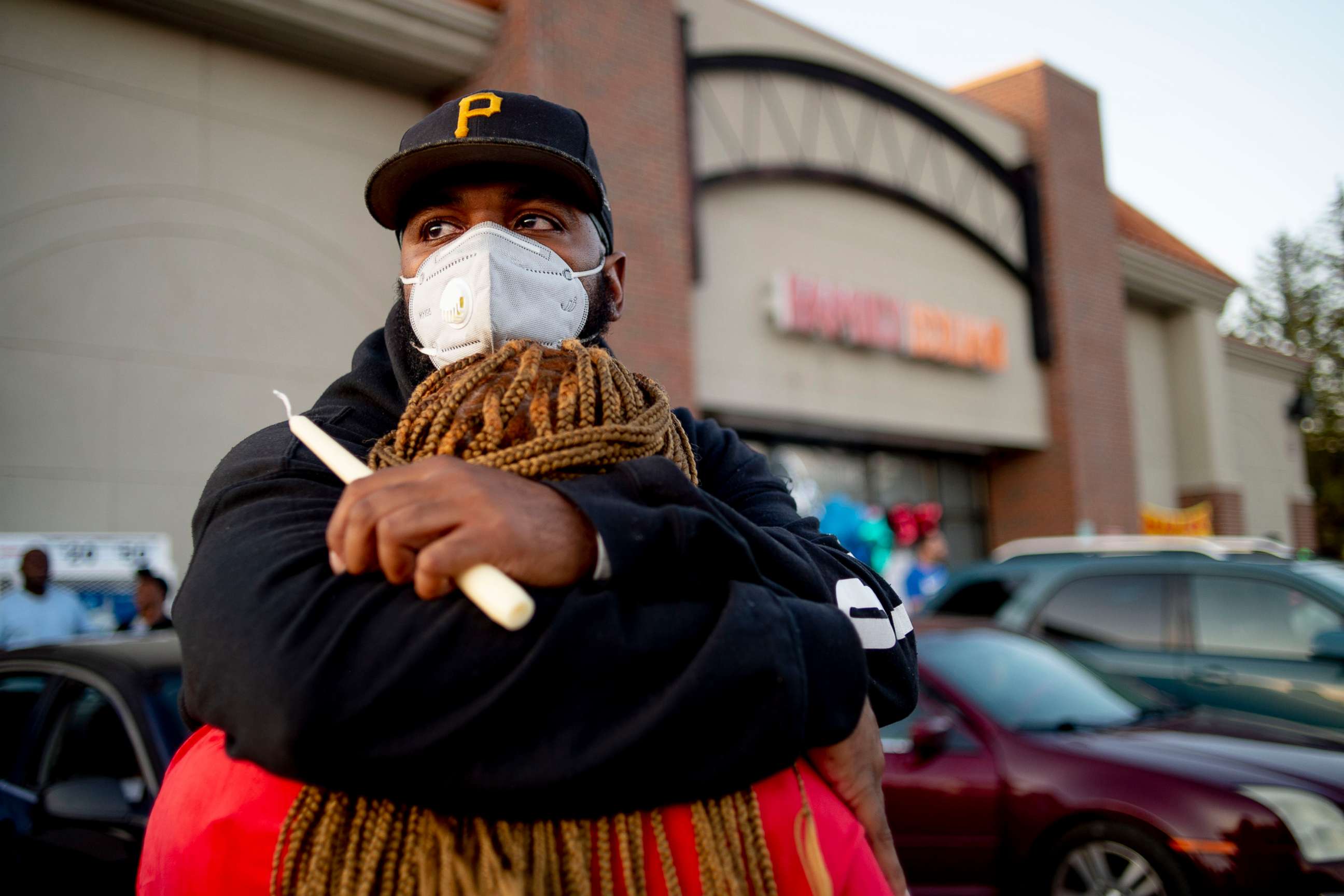 PHOTO:Pete Tedford, cousin, of Calvin Munerlyn, and Dorothy Nelson, sister of Munerlyn, hold each other closely outside a Family Dollar store, May 3, 2020, in Flint, Mich.Munerlyn, a security guard at Family Dollar, was shot and killed May 1 at the store.