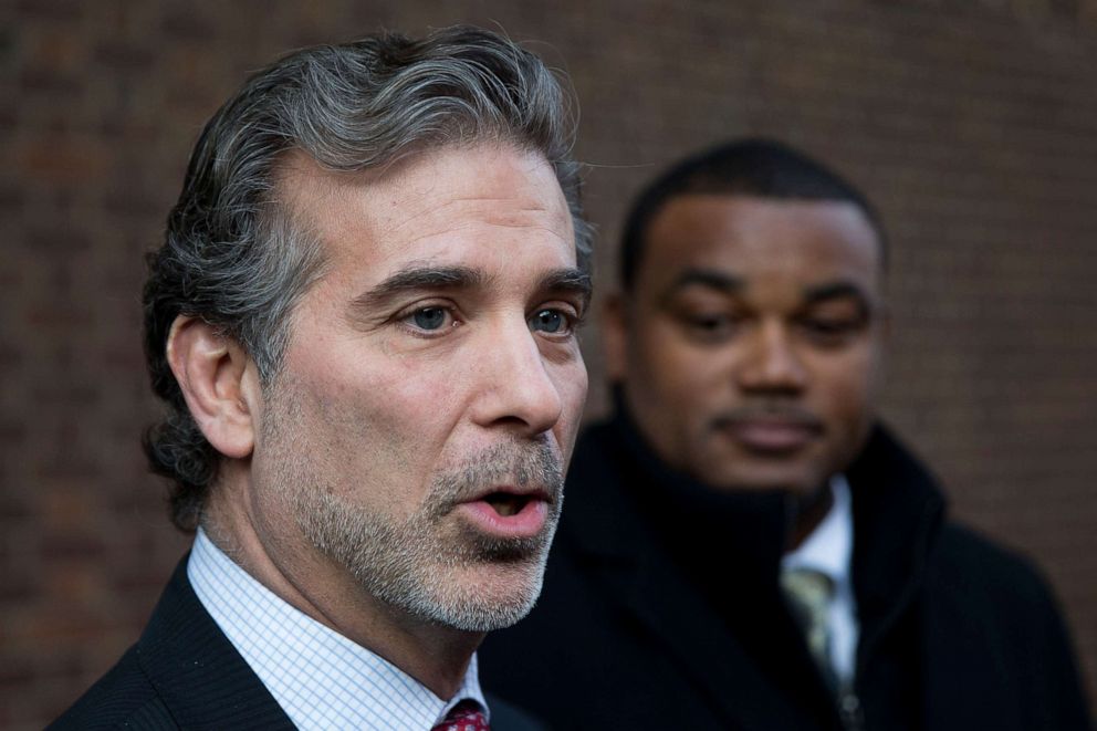 PHOTO: Co-lead players' lawyer Christopher Seeger, left, and client former NFL player Shawn Wooden speak with members of the media after a hearing on the proposed NFL concussion settlement outside of the U.S. Courthouse in Philadelphia, Nov. 19, 2014.