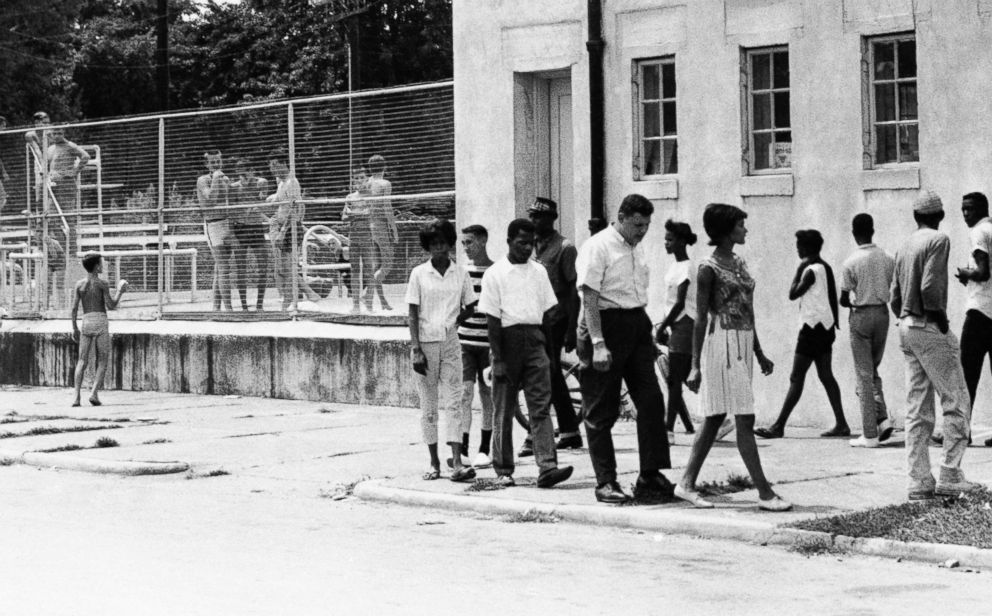 PHOTO: People march in protest of the all-white policy at a segregated swimming pool in Cairo, Ill., July 23, 1962.