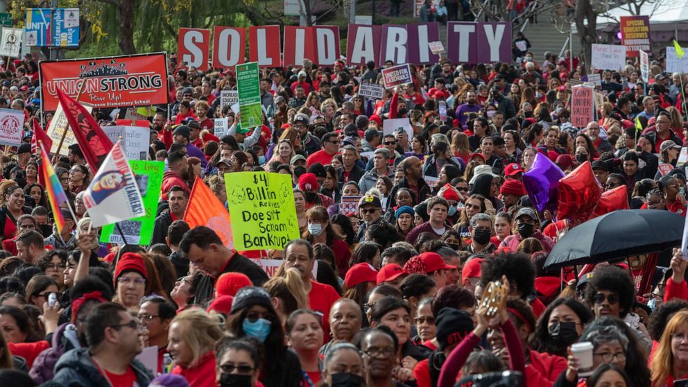 PHOTO: United Teachers of Los Angeles and SEIU 99 members hold a joint rally at Grand Park in a show of solidarity, Mar. 15, 2023, in Los Angeles.