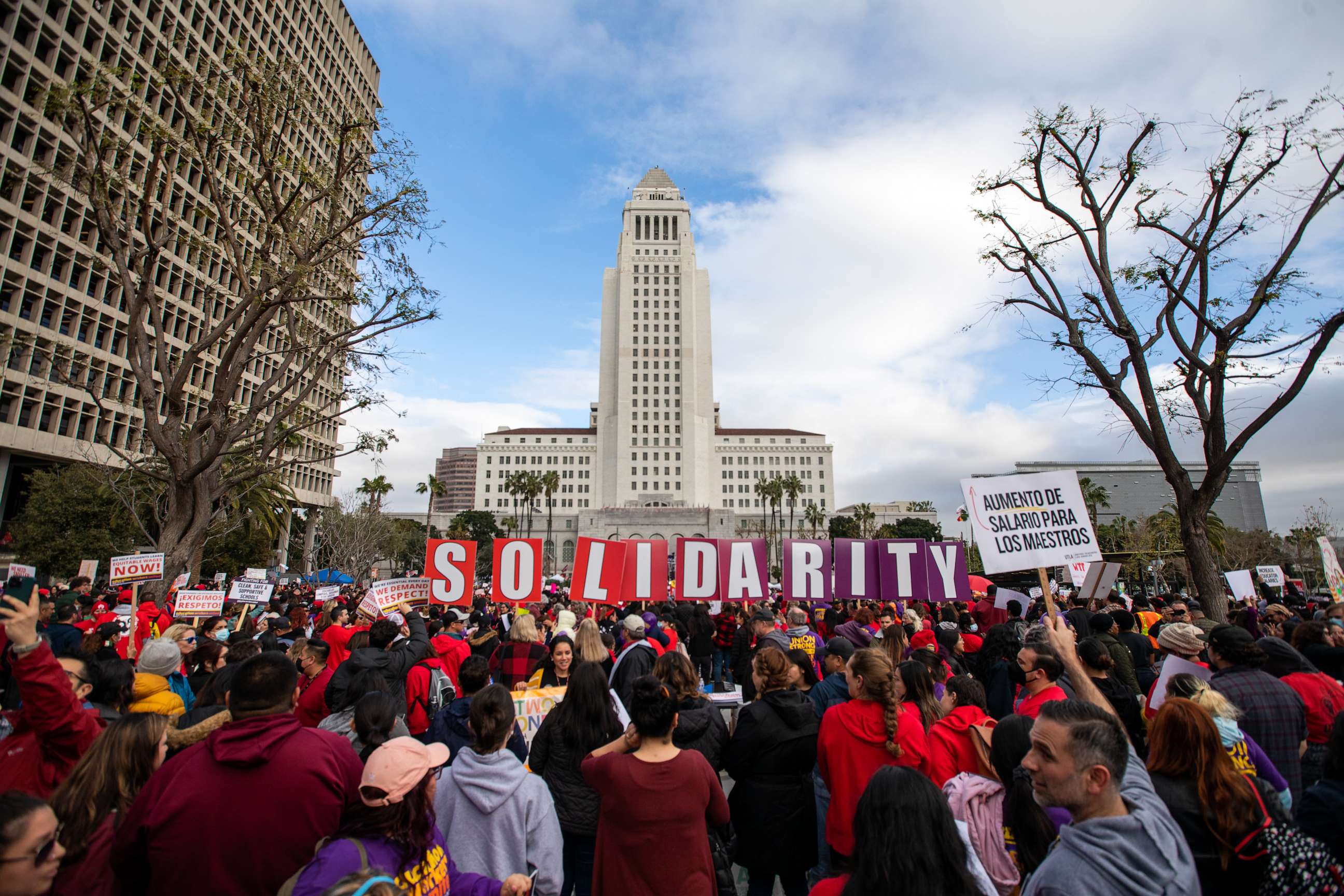 PHOTO: United Teachers of Los Angeles and SEIU 99 members hold a joint rally at Grand Park in front of City Hall in a show of solidarity, Mar. 15, 2023, in Los Angeles.
