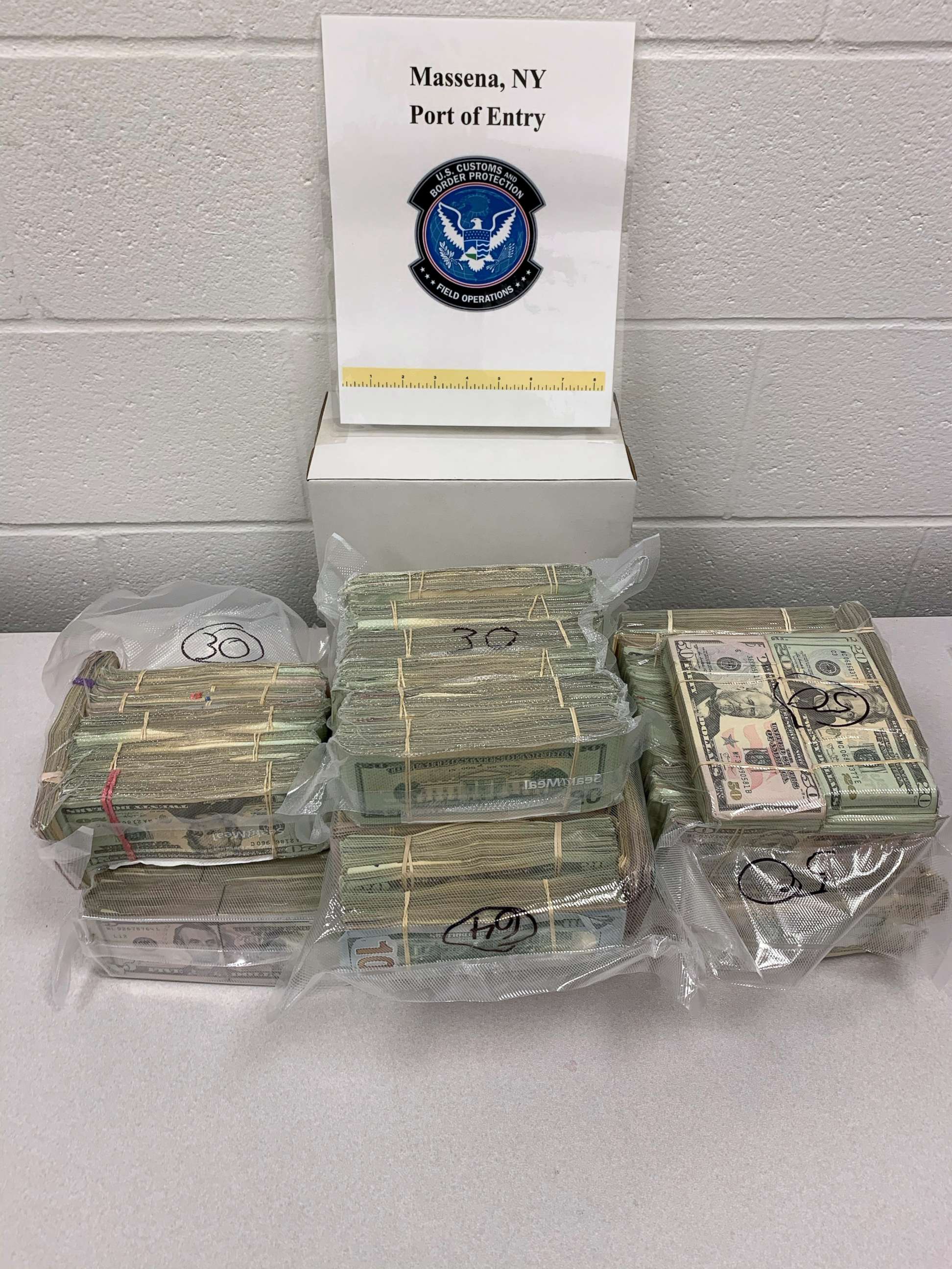 PHOTO: Bundles of currency seized at the border of New York and Canada are seen in an undated handout photo from U.S. Customs and Border Protection.
