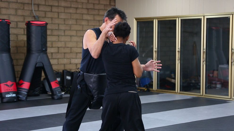 PHOTO: A woman demonstrates how to defend herself using her elbow during an attack.