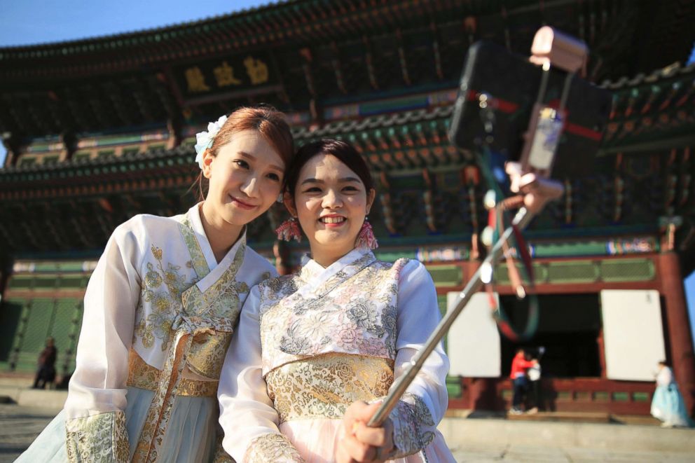 PHOTO: Visitors using a selfie stick to take pictures of themselves at Gyeongbokgung, a palace built by Joseon Dynasty in Seoul, Korea, Oct.25, 2017.