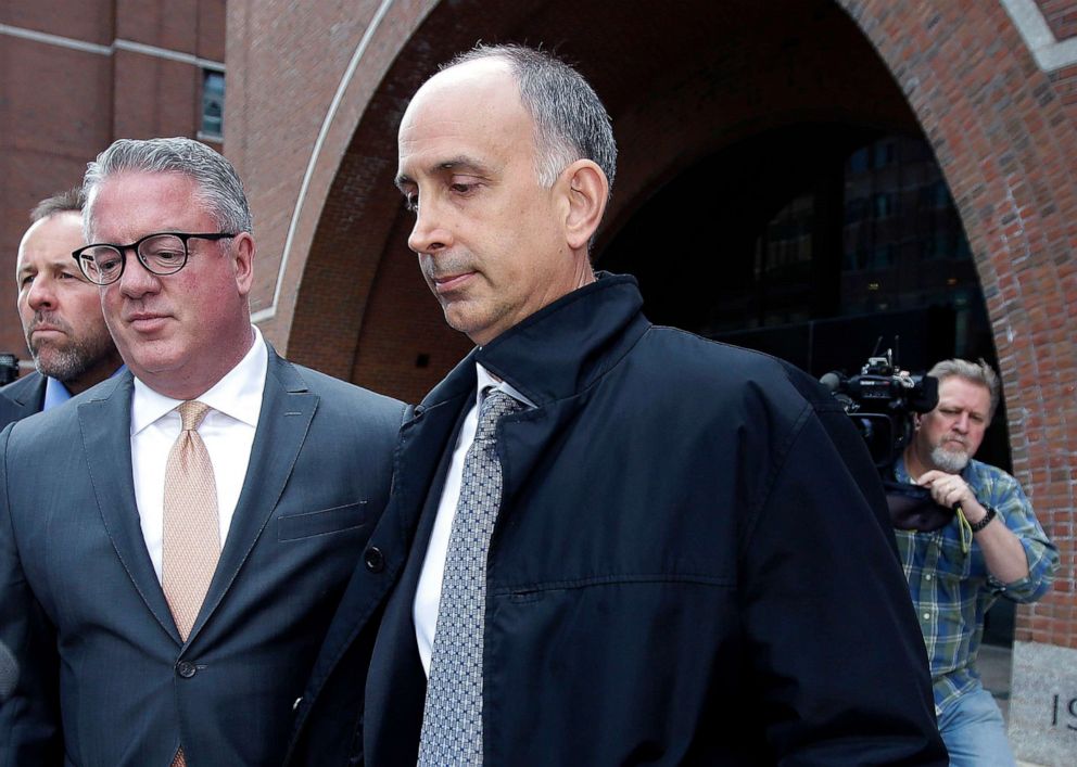 PHOTO: California businessman Stephen Semprevivo departs federal court, May 7, 2019, in Boston, after pleading guilty to charges that he bribed the Georgetown tennis coach to get his son admitted to the school.