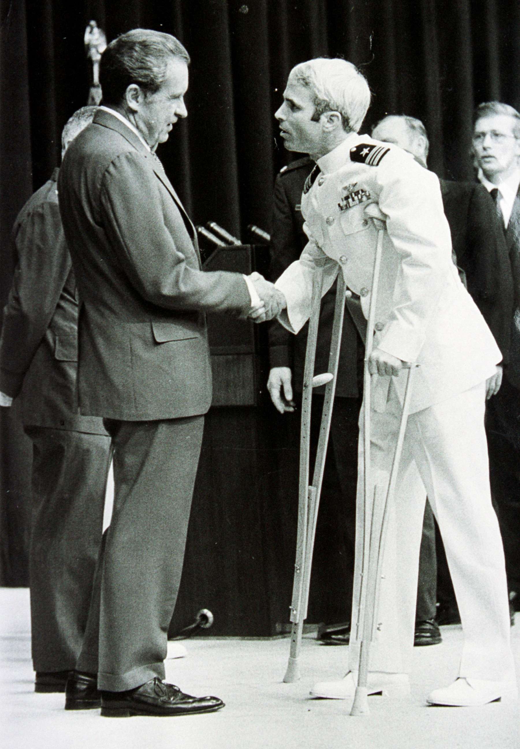 PHOTO: Lieutenant Commander John McCain is welcomed by President Richard Nixon upon his release as a POW during the Vietnam War, May 24, 1973, in Washington.