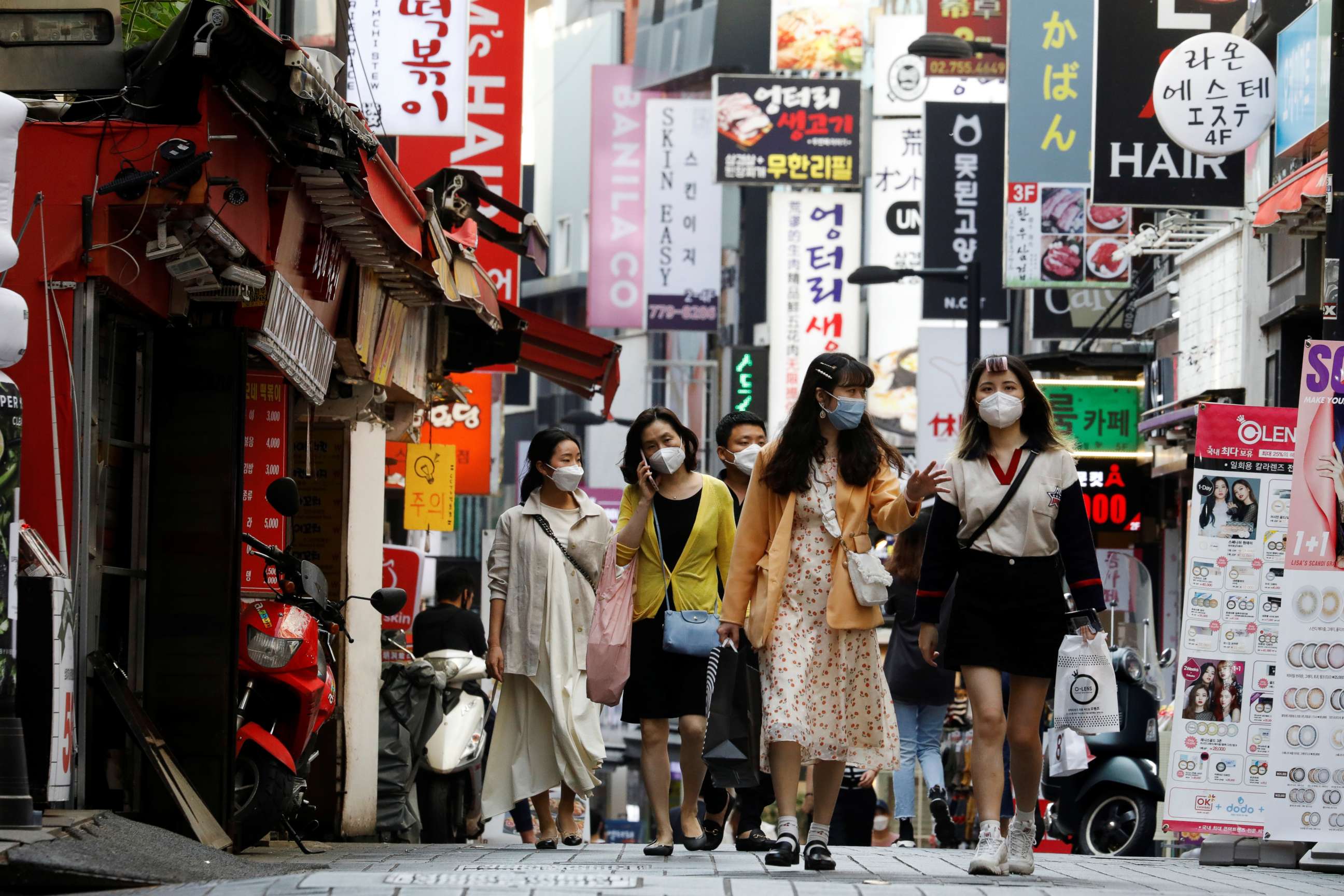 PHOTO: People wearing masks walk at Myeongdong shopping district amid social distancing measures to avoid the spread of the coronavirus disease (COVID-19), in Seoul, South Korea, May 28, 2020.