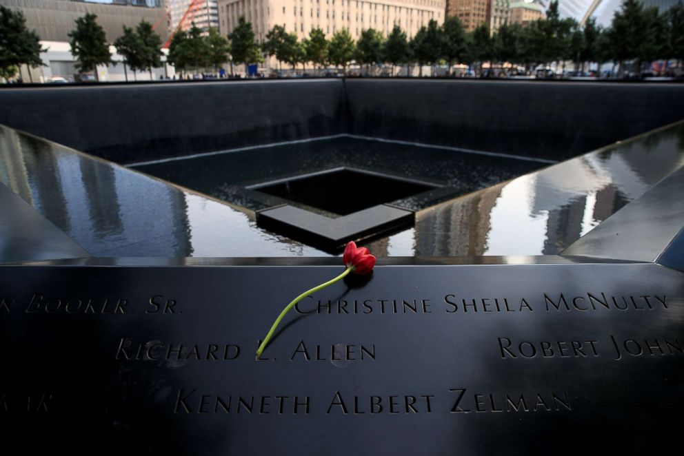 PHOTO: A flower is left at the North pool during a commemoration ceremony for the victims of the September 11 terrorist attacks at the National September 11 Memorial, Sept. 11, 2017, in New York. 