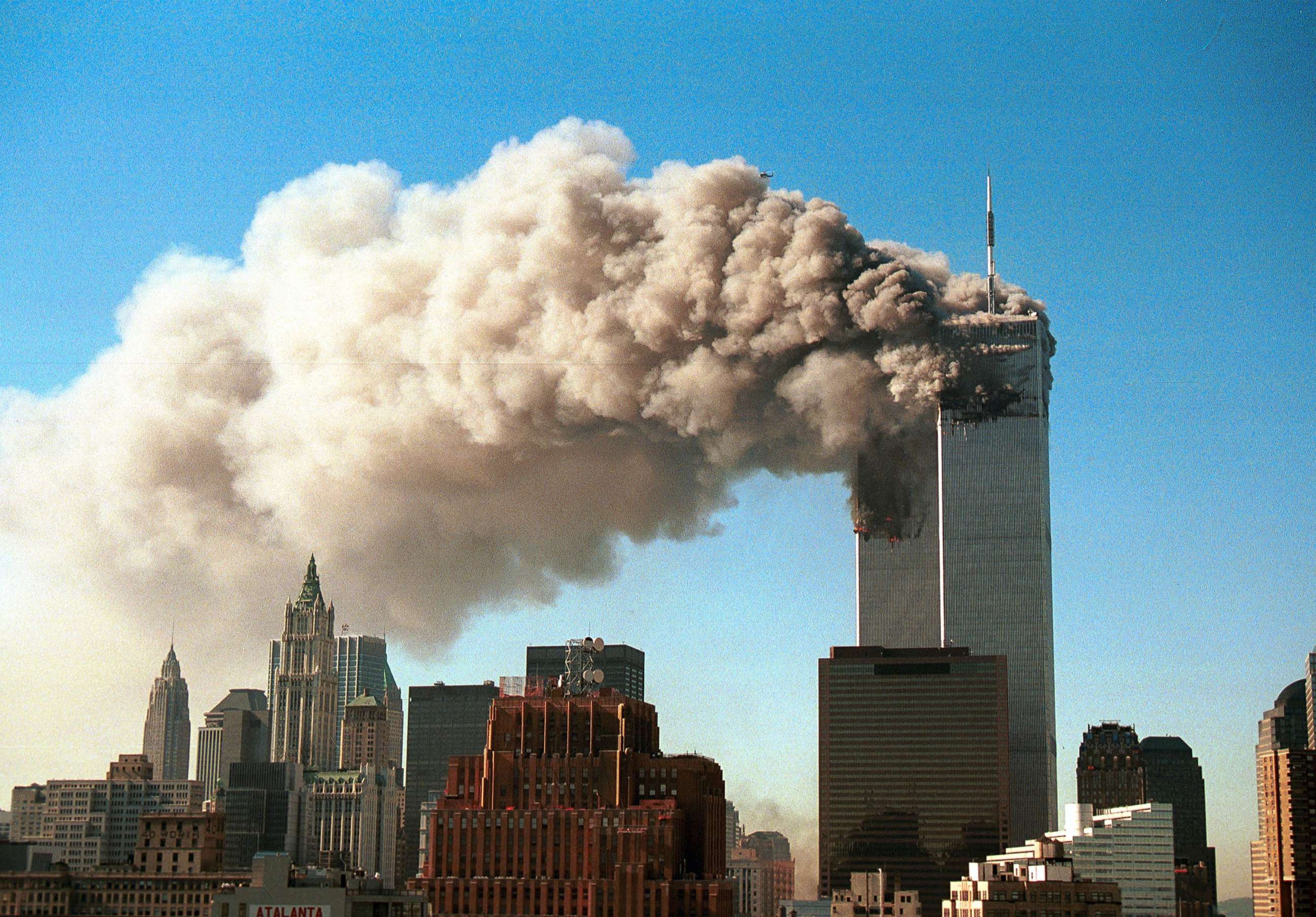 PHOTO: Smoke pours from the twin towers of the World Trade Center after they were hit by two hijacked airliners in a terrorist attack Sept. 11, 2001 in New York.