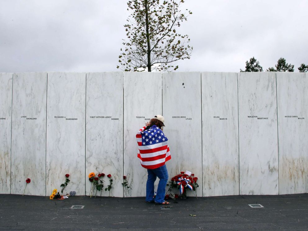 PHOTO: Chrissy Bortz of Latrobe, Pa., pays her respects at the Wall of Names at the Flight 93 National Memorial in Shanksville, Pa. after a Service of Remembrance, Sept. 11, 2018, as the nation marks the 17th anniversary of the Sept. 11, 2001 attacks.
