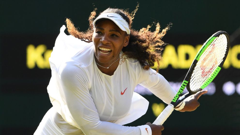 PHOTO: Serena Williams serves to France's Kristina Mladenovic in their women's singles third round match on the fifth day of the 2018 Wimbledon Championships, in southwest London, July 6, 2018.