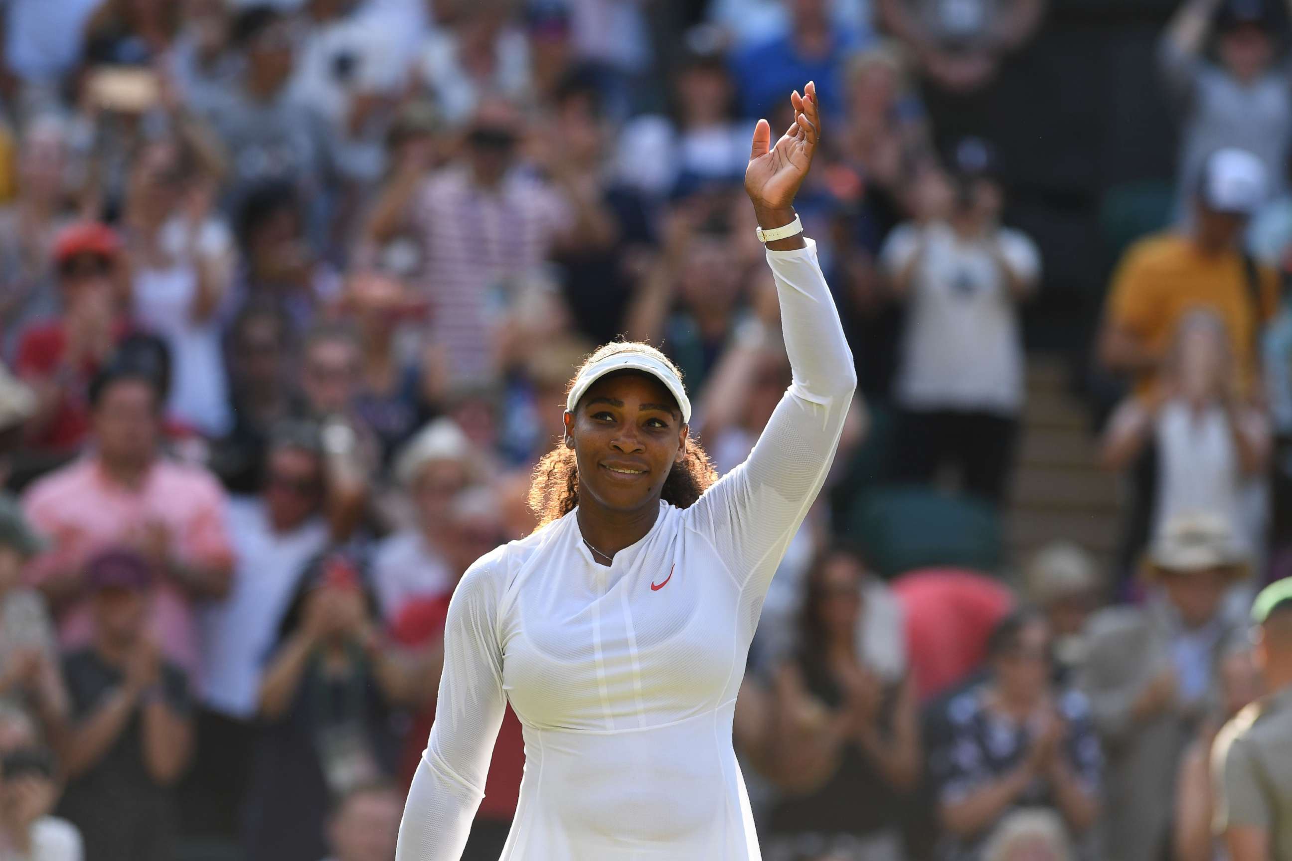 PHOTO: Serena Williams celebrates after beating France's Kristina Mladenovic 7-5, 7-6 in their women's singles third round match on the fifth day of the 2018 Wimbledon Championships, southwest London,  July 6, 2018. 