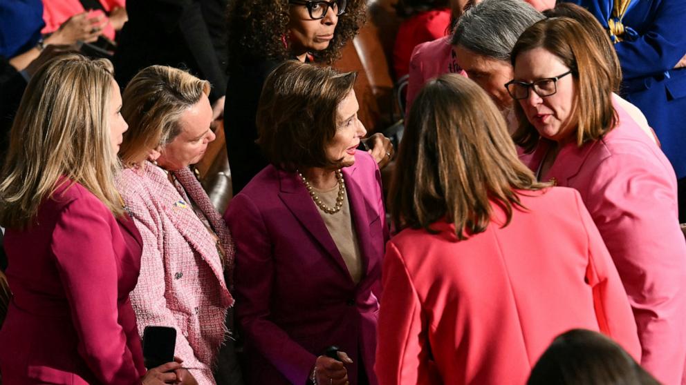PHOTO: Rep. Nancy Pelosi gathers with other female members wearing pink ahead of President Donald Trump's address to a joint session of Congress in the House Chamber of the Capitol in Washington, Mar. 4, 2025.