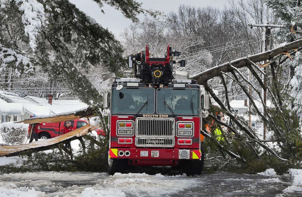 PHOTO: A tree branch fallen from the weight of heavy snow lies on top of a fire truck in East Hartford, Conn., March 8, 2018. 