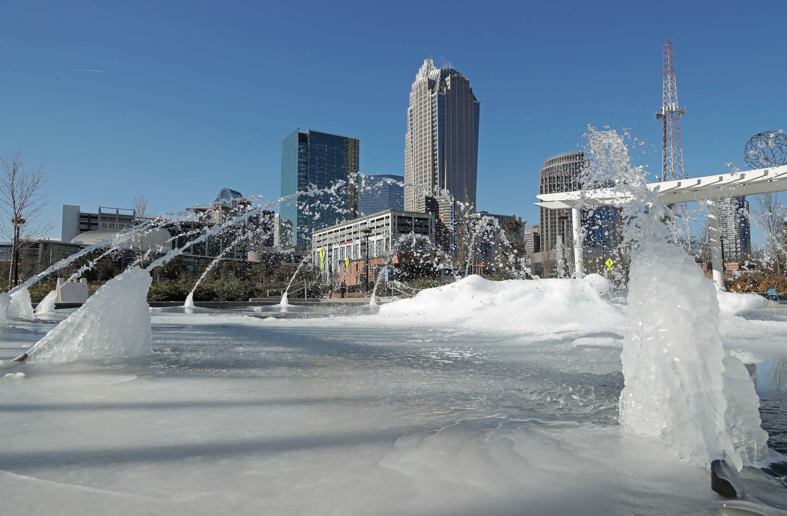 PHOTO: Water squirts from a frozen fountain near downtown in Charlotte, N.C., Jan. 2, 2018.