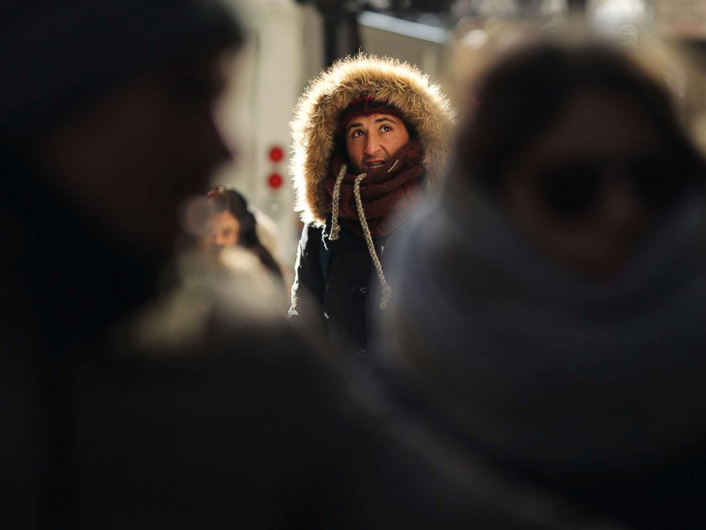 PHOTO: People walk through a frigid Manhattan, Dec. 28, 2017, in New York City.