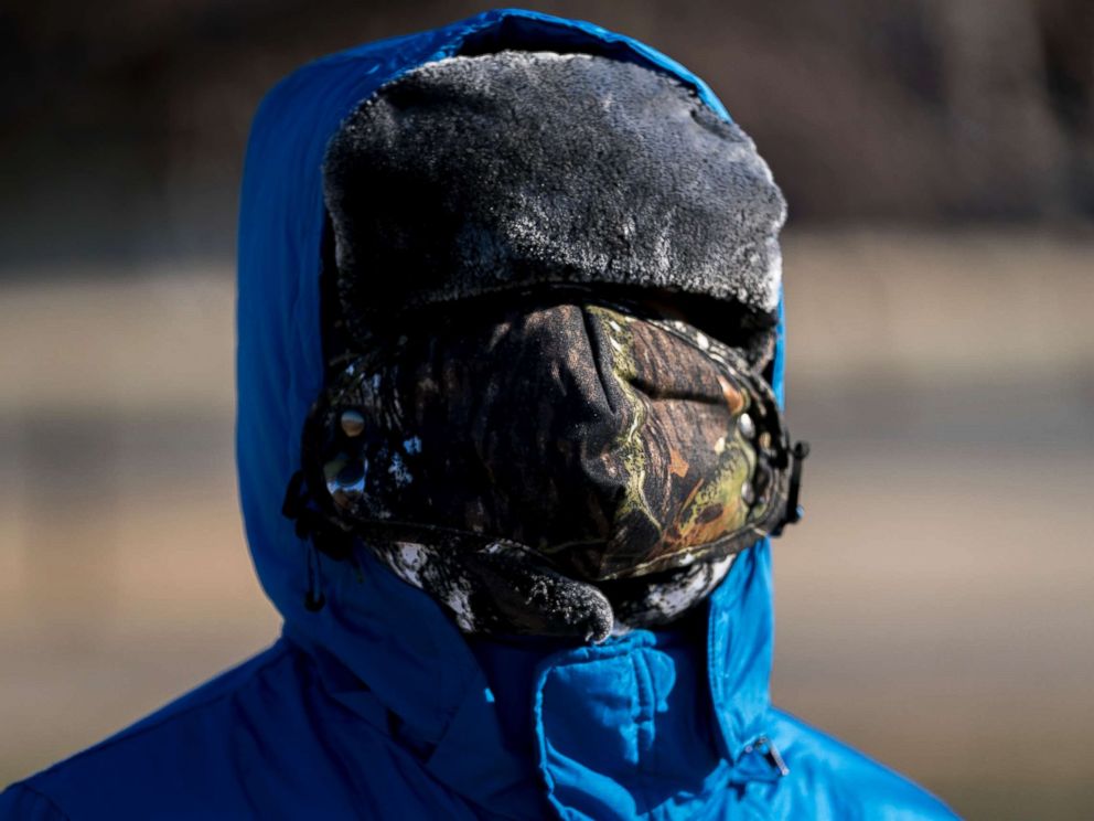 PHOTO: A boy has his face bundled against temperatures in the teens on the National Mall, Dec. 28, 2017, in Washington.