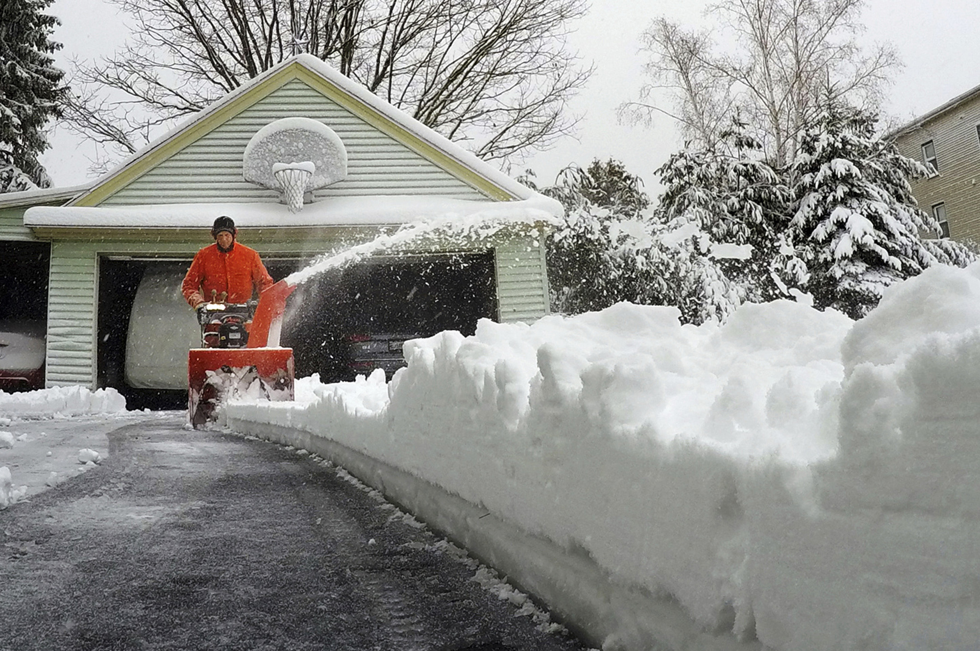 PHOTO: A Portland, Maine resident uses a snowblower to clear snow during a nor'easter, March 8, 2018. 