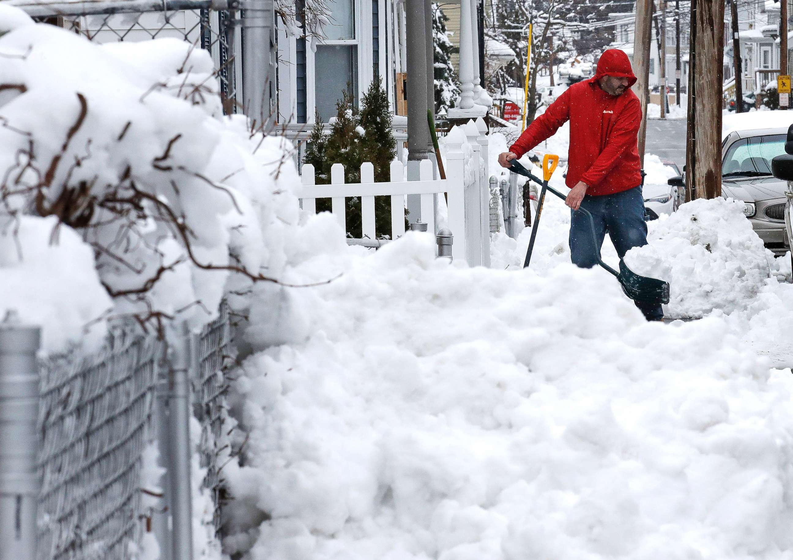 PHOTO: Albert Rodriguez shovels a sidewalk in Haverhill, Mass., March 8, 2018. 