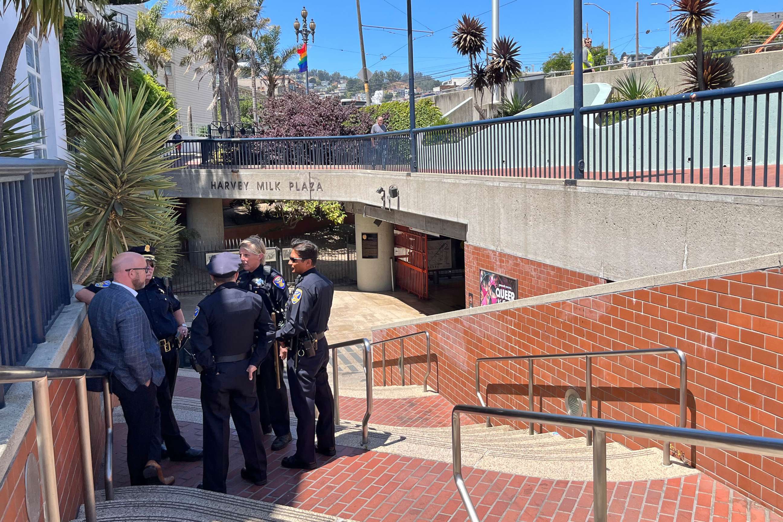 PHOTO: Police personnel confer outside the entrance to the Castro Muni Metro station following a shooting in San Francisco, June 22, 2022.