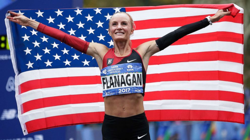 PHOTO: Shalane Flanagan of the United States poses for pictures after crossing the finish line first in the women's division of the New York City Marathon in New York, Nov. 5, 2017.