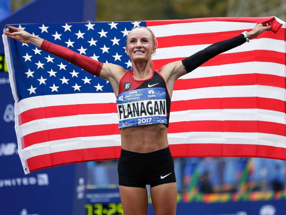 PHOTO: Shalane Flanagan of the United States poses for pictures after crossing the finish line first in the womens division of the New York City Marathon in New York, Nov. 5, 2017.