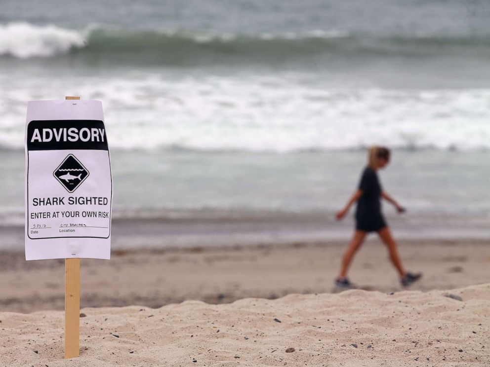 PHOTO: Warning signs are placed along the beach to warn swimmers and surfers of recent shark sightings in San Clemente, Calif., May 23, 2017.