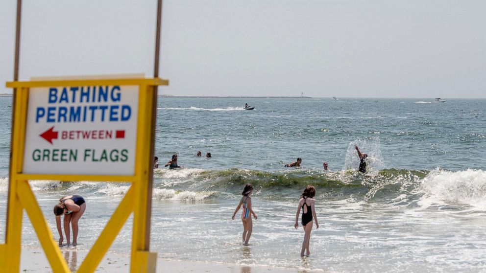 PHOTO: A lifeguard on a Jet Ski monitors for sharks amid an increase in sightings at Jones Beach, New York, July 1, 2022.