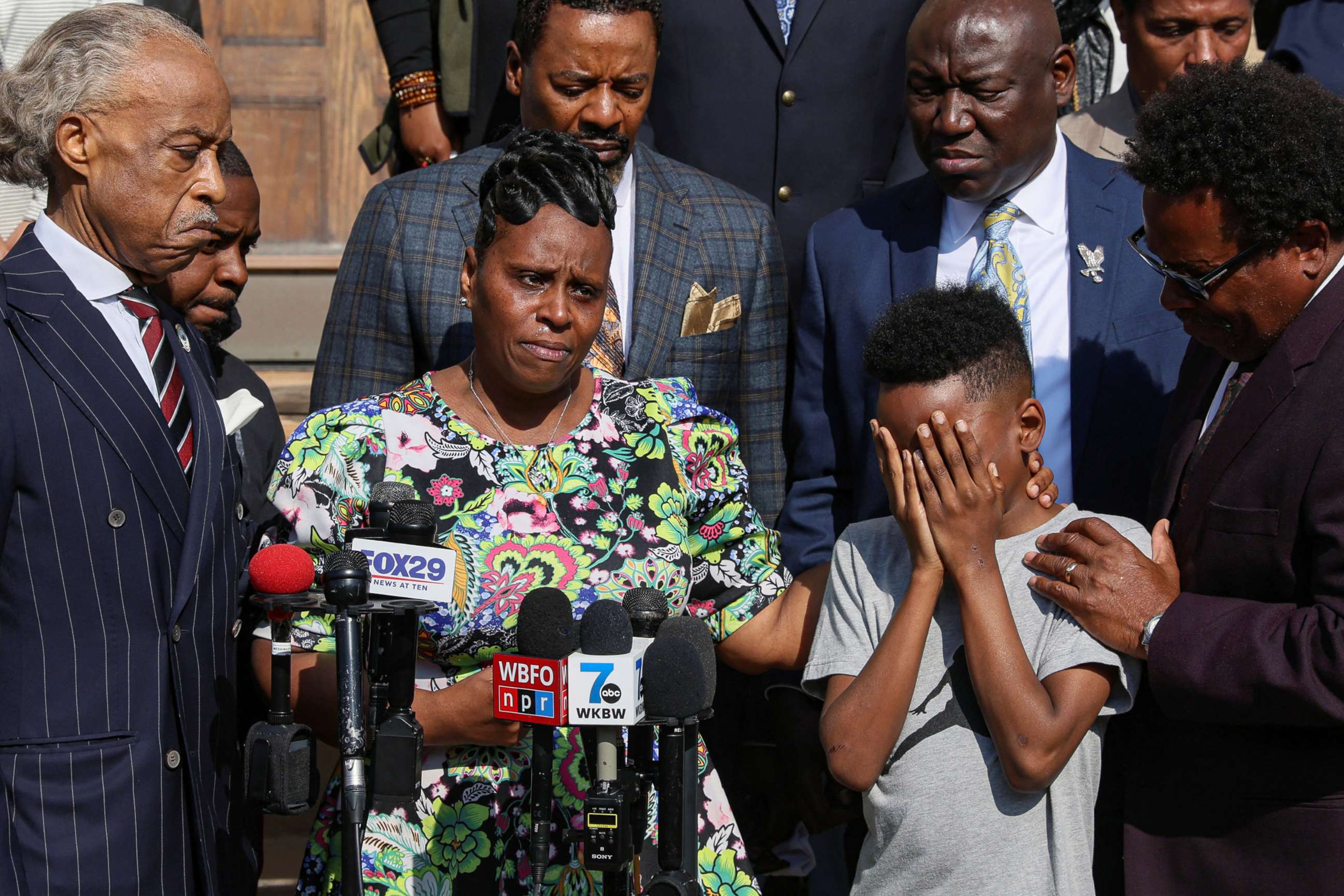 PHOTO: Jacob Patterson, son of shooting victim Heyward Patterson, is comforted by his mother Tirzah Patterson during a news conference with Reverend Al Sharpton, left, in the wake of a shooting at a supermarket in Buffalo, New York, May 19, 2022.