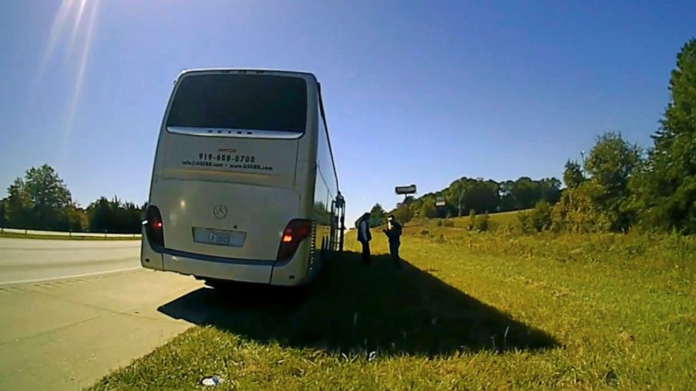 PHOTO: In this screenshot of a video released by Spartanburg County Sheriff's Office, law enforcement officers stop a contracted bus in Spartanburg County, S.C., transporting students from Shaw University to a conference in Atlanta on Oct. 5, 2022.